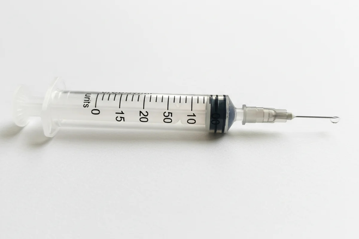 Insulin syringe closeup with measurement markings for peptide dosing
